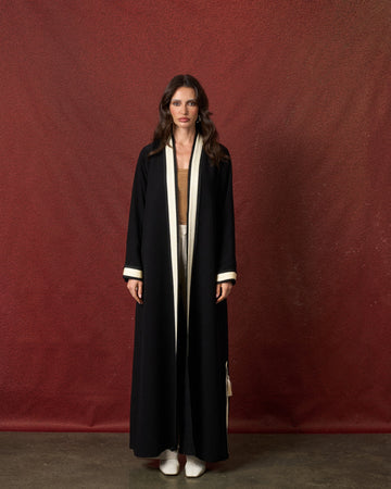 Buy online: the Twist abaya by Le Reflet, premium quality with a modern twist detail. Trending design, fast home delivery across Qatar and Doha.